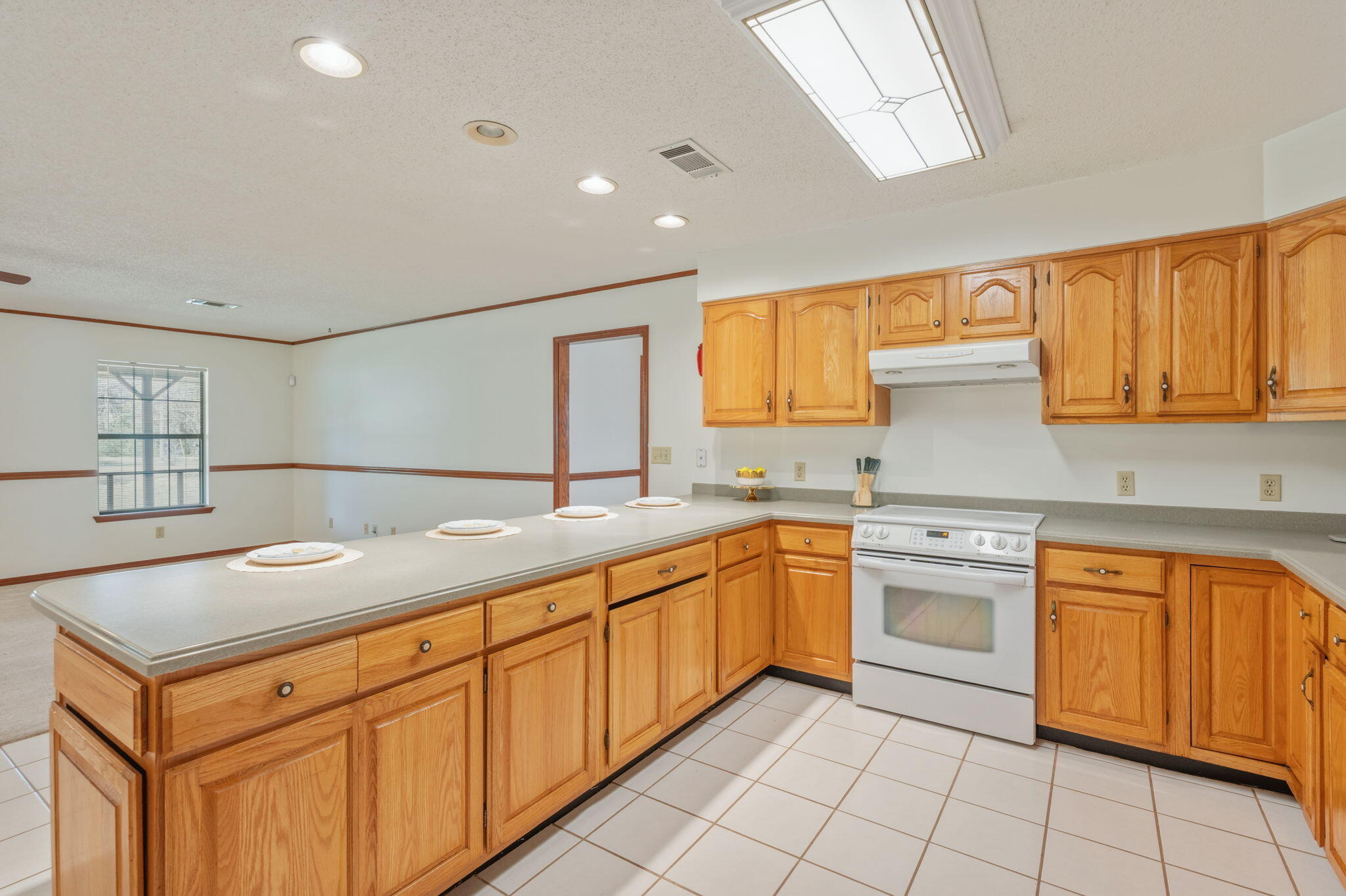 4841 Antioch Road Crestview, FL 32536 - Photo 18 of 70 a kitchen with granite countertop sink and cabinets