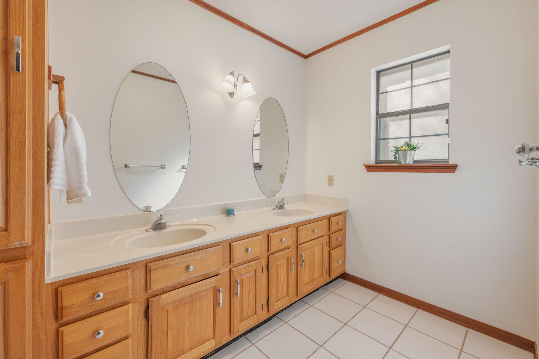 4841 Antioch Road Crestview, FL 32536 - Photo 26 of 70 a bathroom with a double vanity sink and a mirror