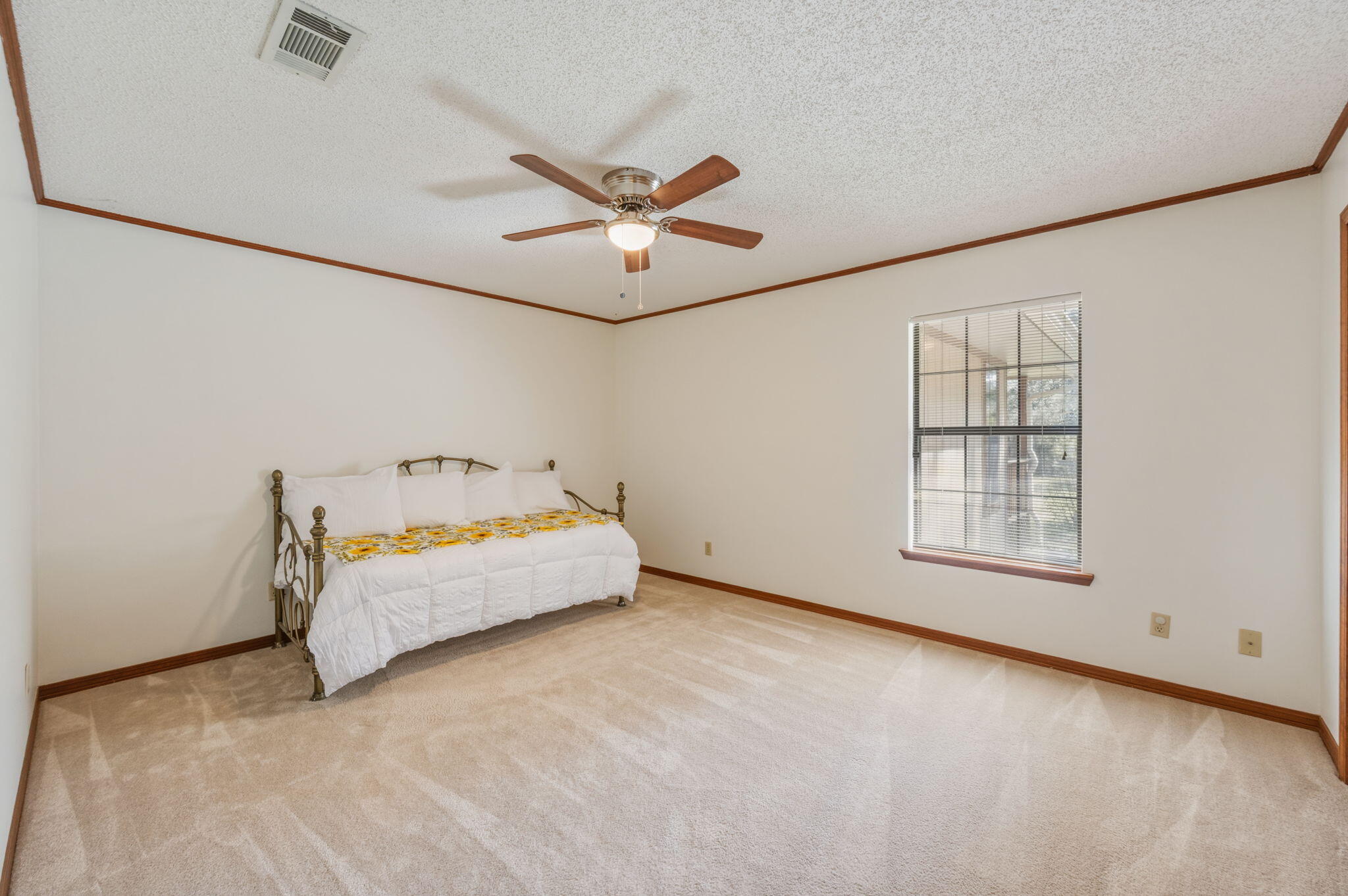 4841 Antioch Road Crestview, FL 32536 - Photo 29 of 70 an empty room with windows and fan