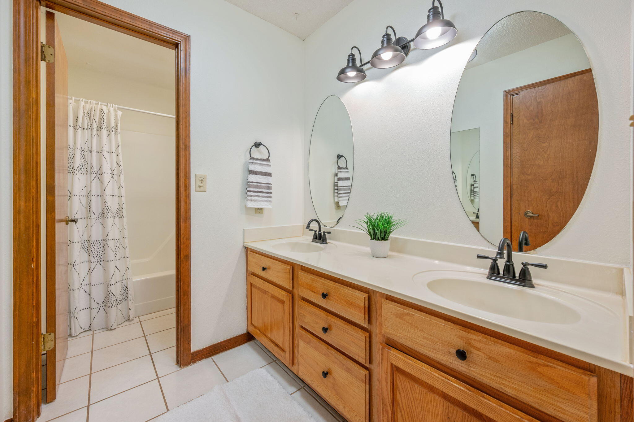 4841 Antioch Road Crestview, FL 32536 - Photo 31 of 70 a bathroom with a double vanity sink and a mirror