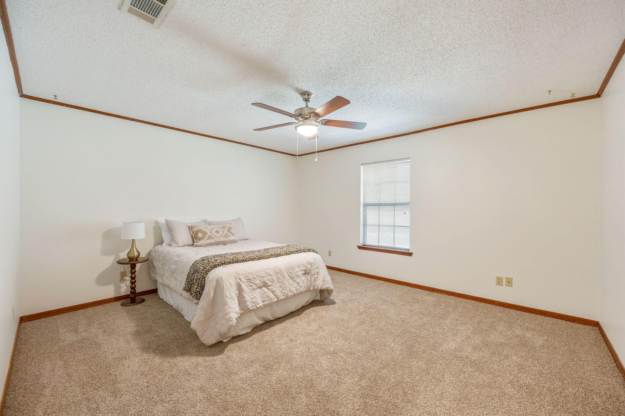 4841 Antioch Road Crestview, FL 32536 - Photo 33 of 70 a bed room with a bed and a ceiling fan