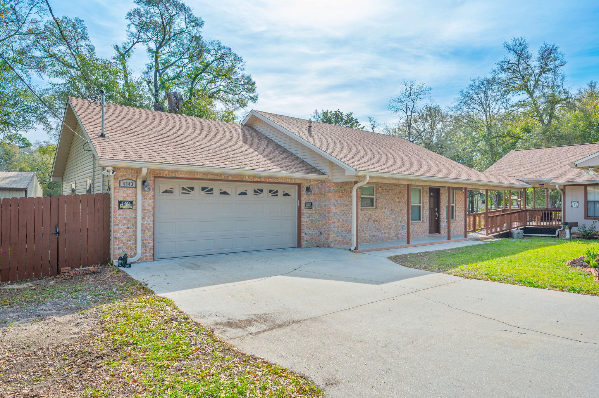 4841 Antioch Road Crestview, FL 32536 - Photo 47 of 70 a front view of a house with a garden and yard