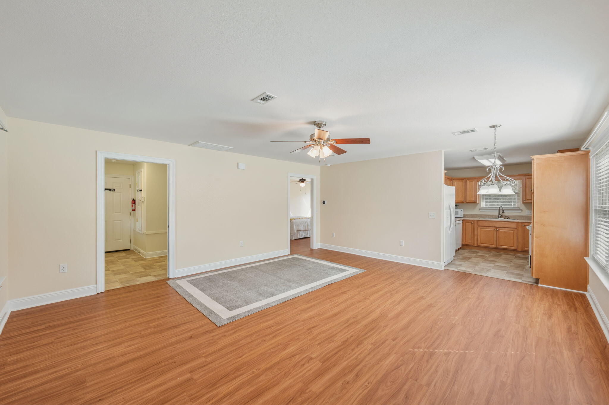 4841 Antioch Road Crestview, FL 32536 - Photo 49 of 70 a view of a kitchen with a dishwasher and wooden floor