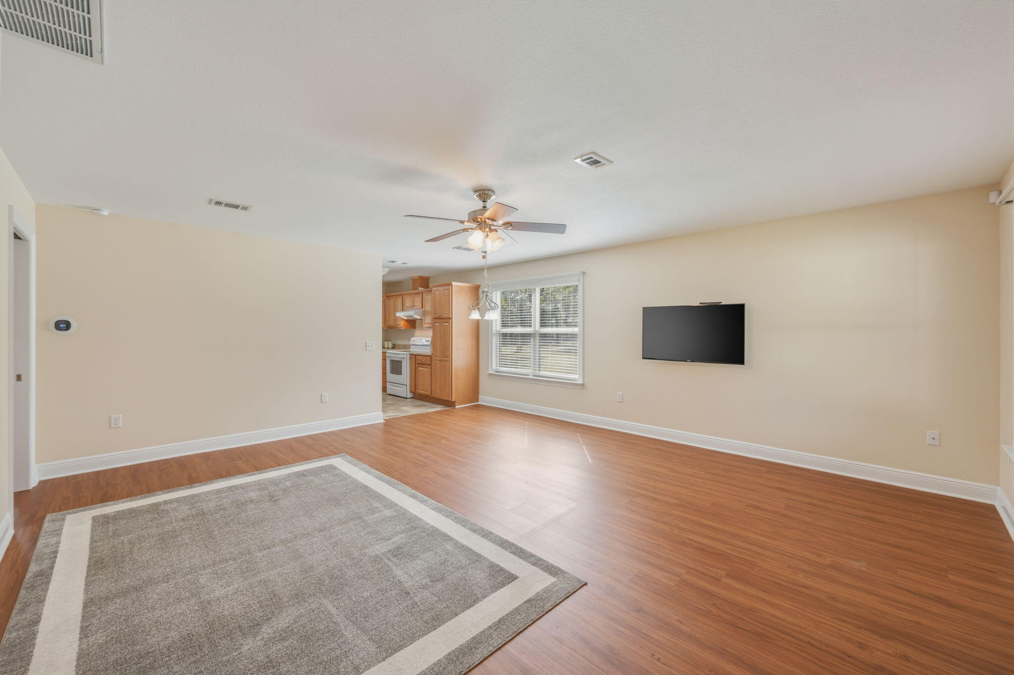4841 Antioch Road Crestview, FL 32536 - Photo 50 of 70 wooden floor in an empty room with a window