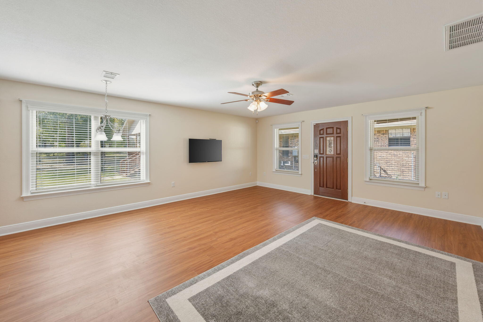 4841 Antioch Road Crestview, FL 32536 - Photo 51 of 70 a view of an empty room with window and wooden floor
