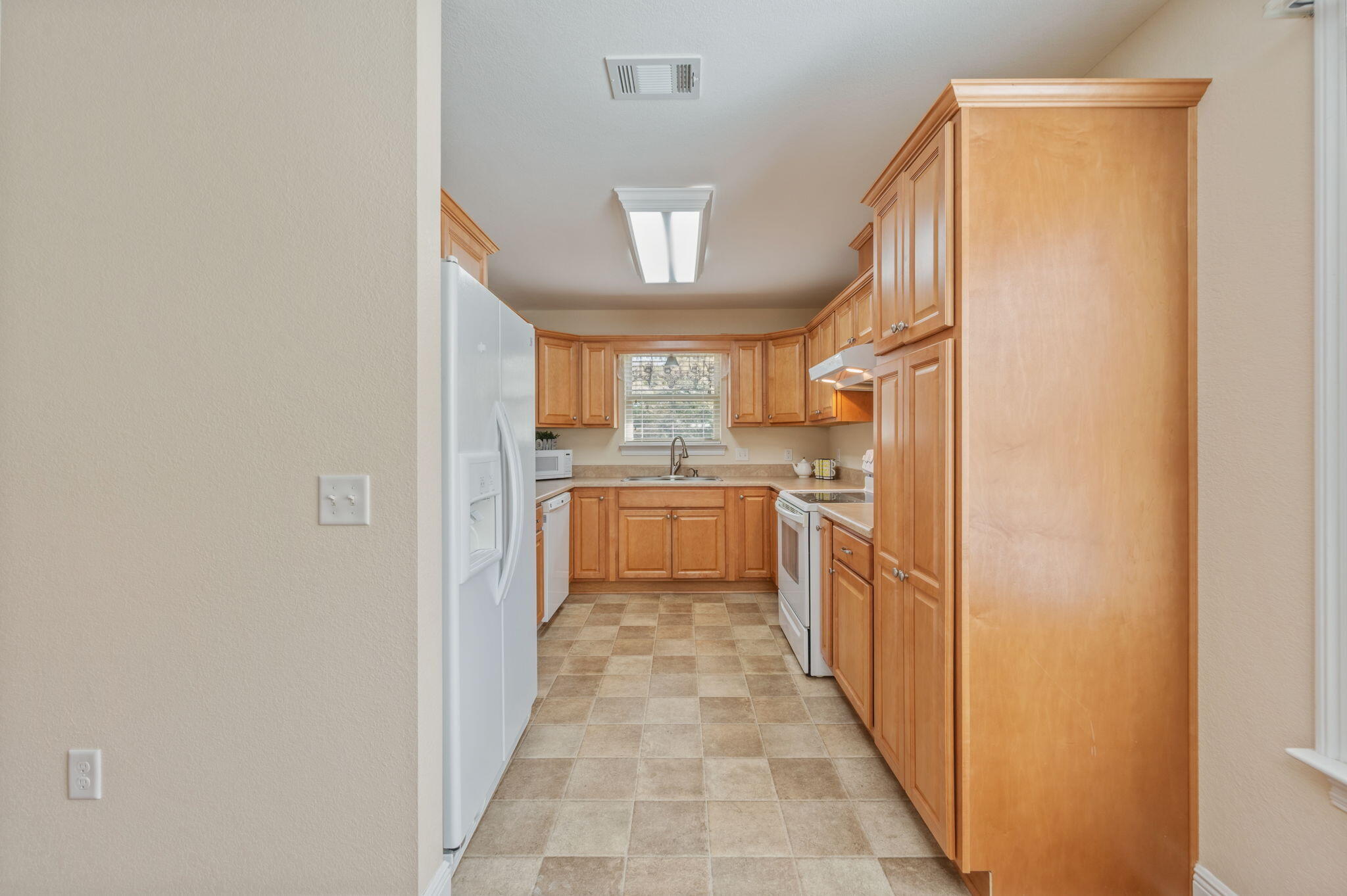 4841 Antioch Road Crestview, FL 32536 - Photo 53 of 70 a view of a kitchen from the hallway