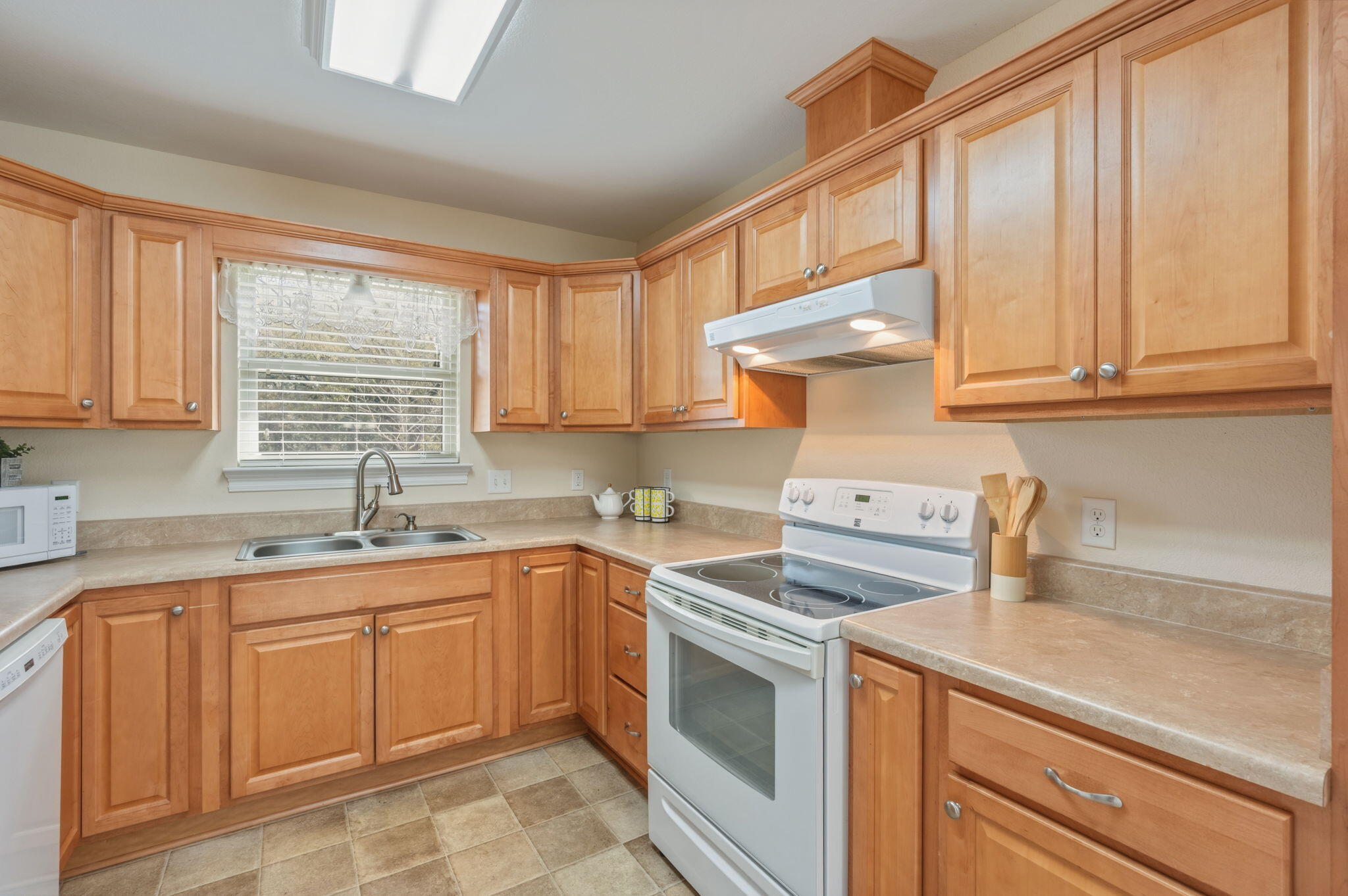 4841 Antioch Road Crestview, FL 32536 - Photo 54 of 70 a kitchen with a sink stove and cabinets