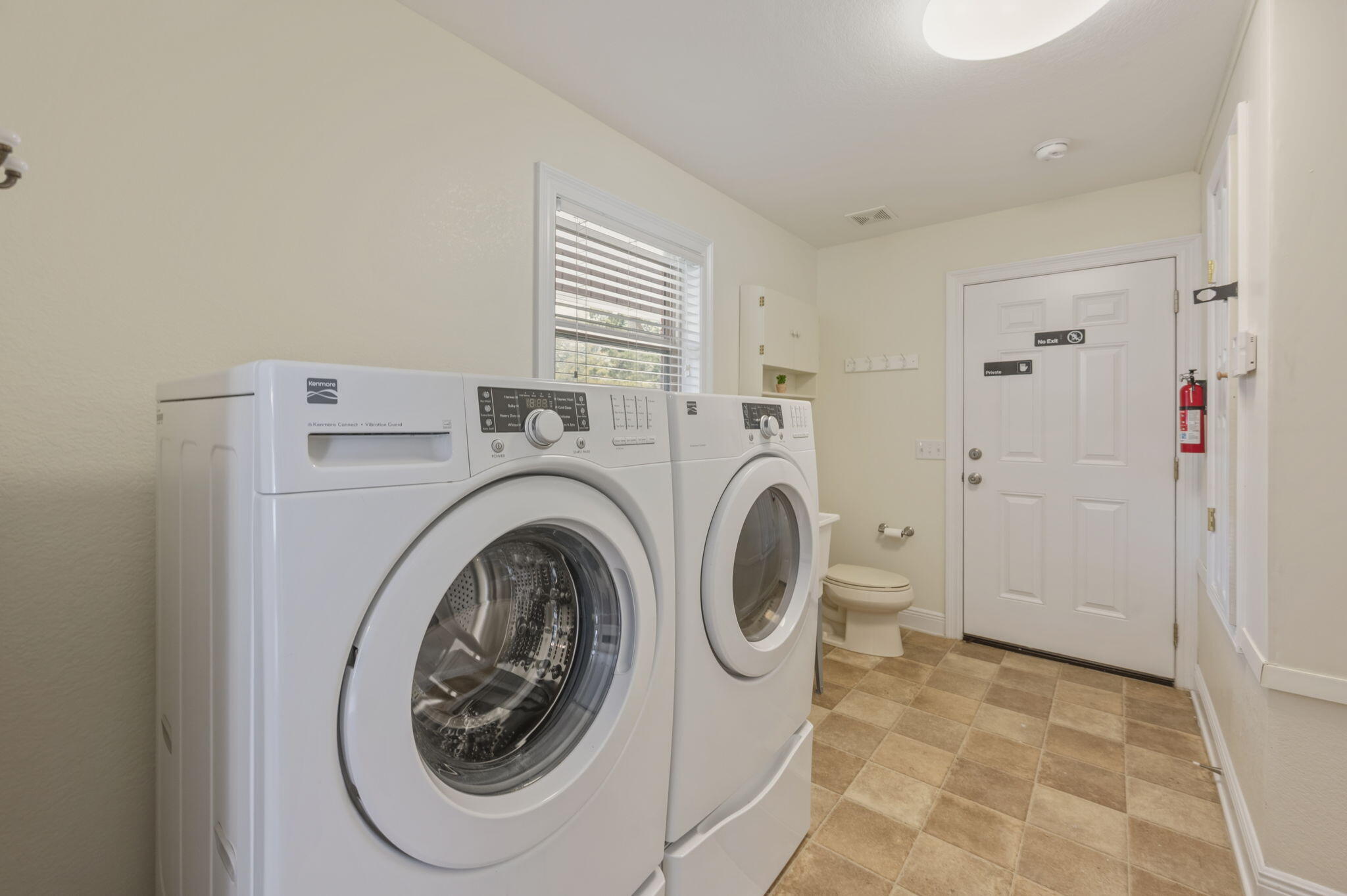 4841 Antioch Road Crestview, FL 32536 - Photo 62 of 70 a utility room with dryer and washer