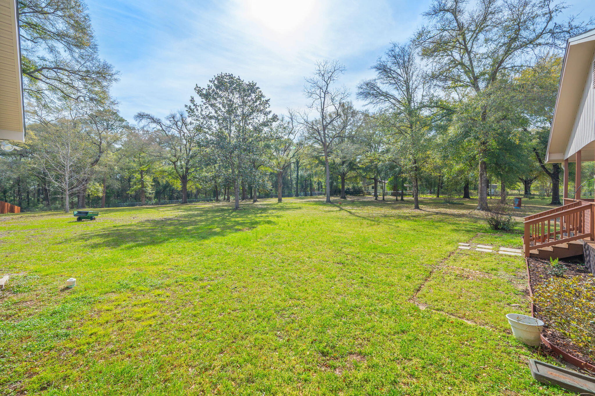 4841 Antioch Road Crestview, FL 32536 - Photo 67 of 70 a swimming pool with lawn chairs yard and trees