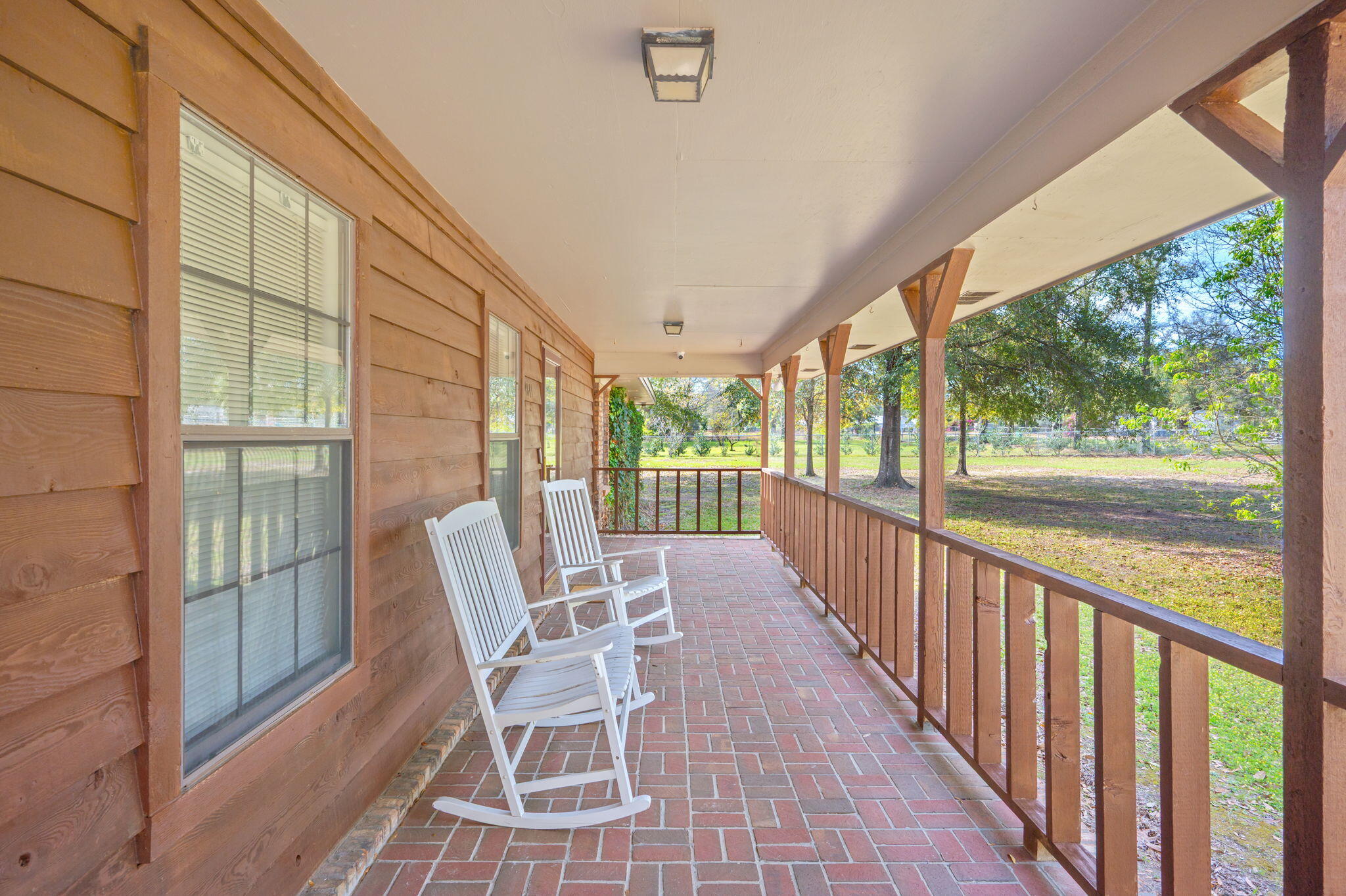4841 Antioch Road Crestview, FL 32536 - Photo 8 of 70 a view of a chairs and table in the balcony