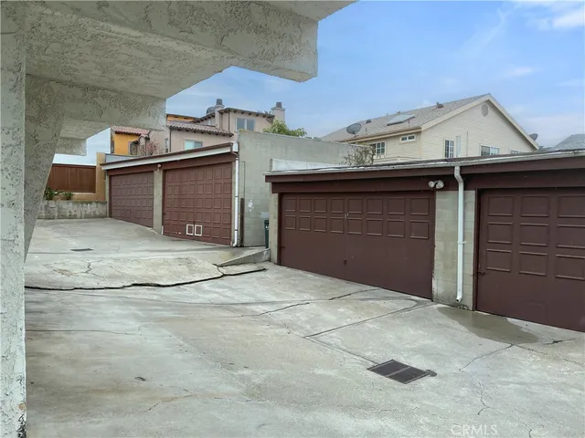 a view of a house with a backyard and a tree