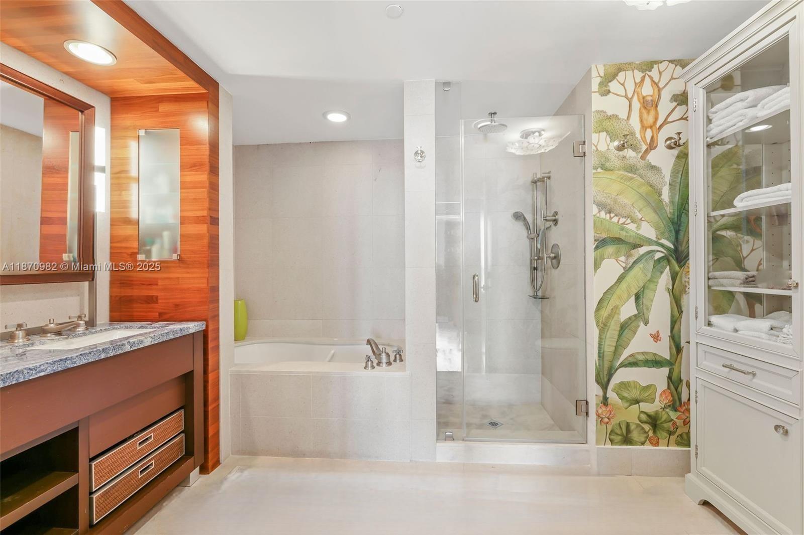 6799 Collins Avenue, Unit 1601 Miami Beach, FL 33141 - Photo 11 of 27 a bathroom with a bathtub and a shower