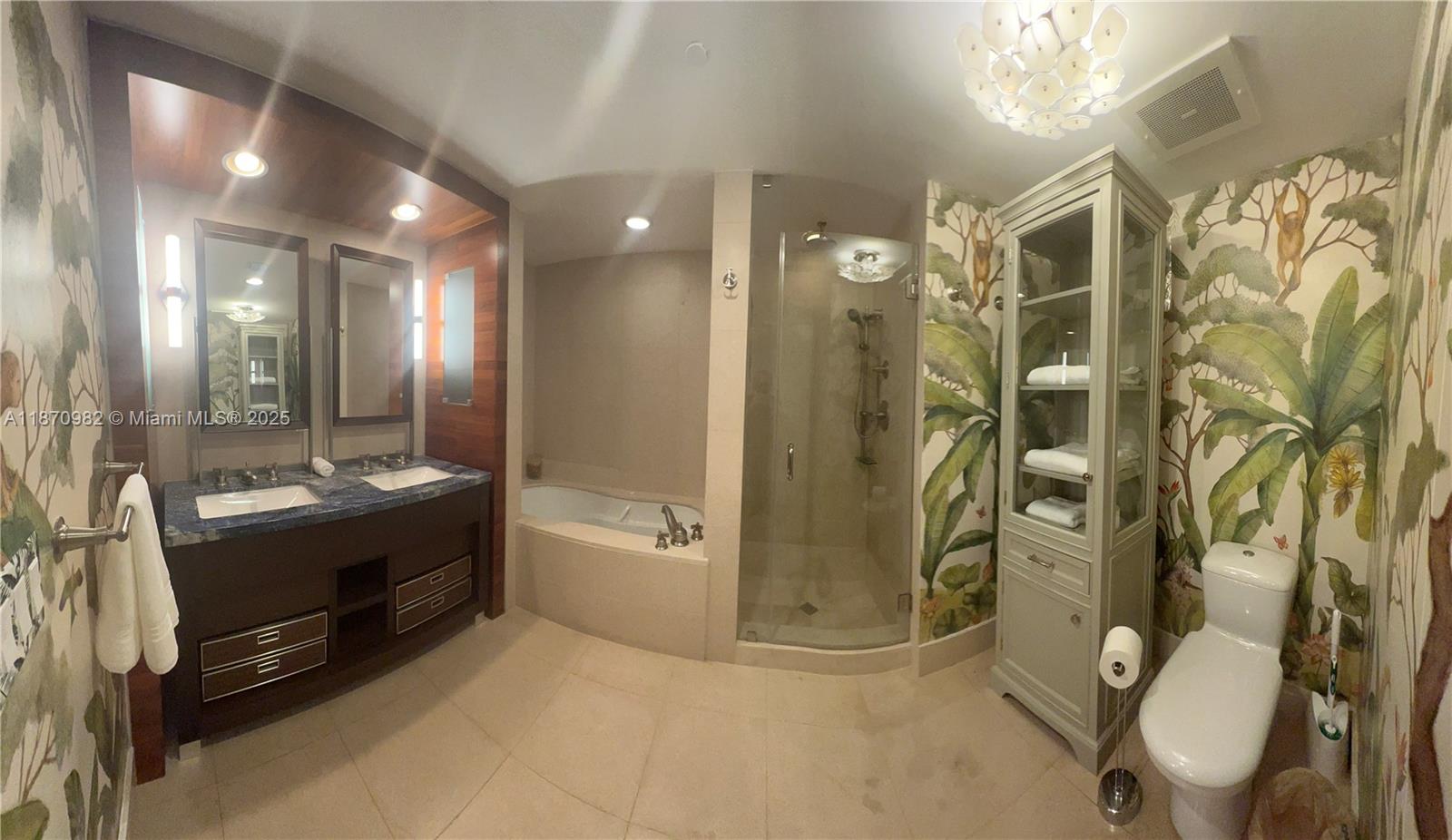 6799 Collins Avenue, Unit 1601 Miami Beach, FL 33141 - Photo 10 of 27 a bathroom with a double vanity sink toilet and shower