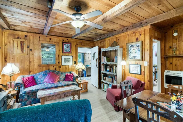 a reading room with furniture and a chandelier