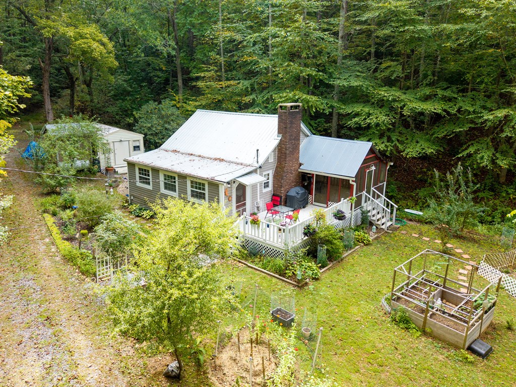 64 Timberline Road Murphy, NC 28906 - Photo 2 of 45 an aerial view of a house with swimming pool and large trees