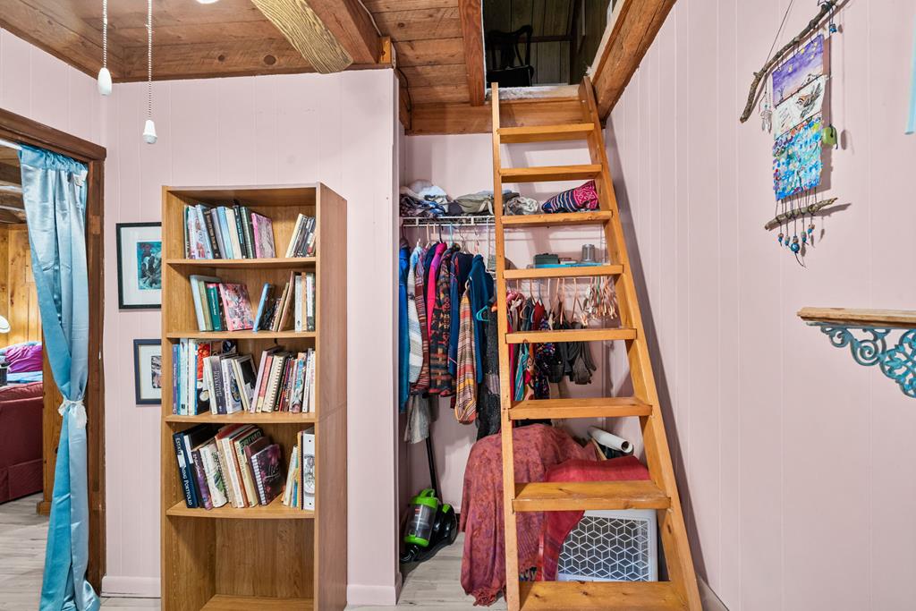 64 Timberline Road Murphy, NC 28906 - Photo 21 of 45 a view of walk in closet with clothes and shoes