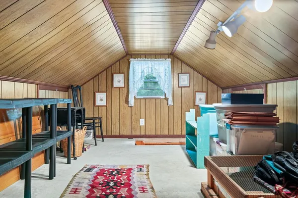 a room with lots of furniture and a window