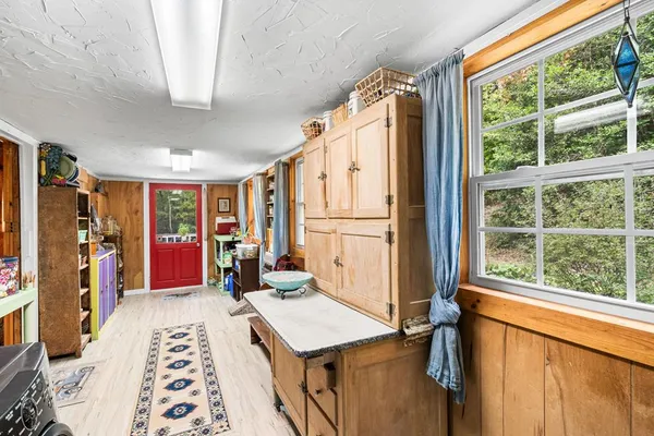 a bed room with a bed and a window