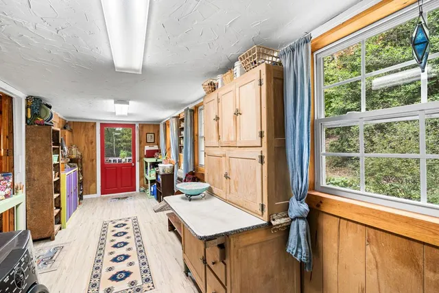 a bed room with a bed and a window