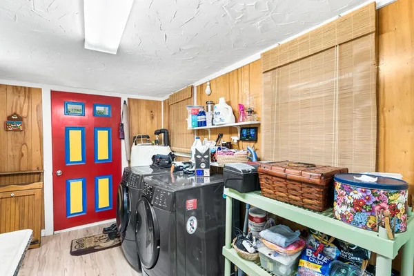 a view of an chairs and table in a room