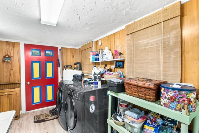 a view of an chairs and table in a room