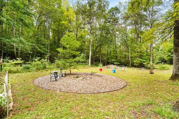 a view of a swimming pool with an outdoor space and seating area