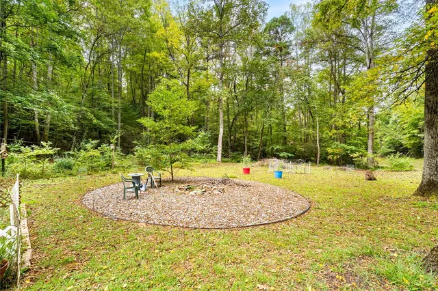 a view of a swimming pool with an outdoor space and seating area