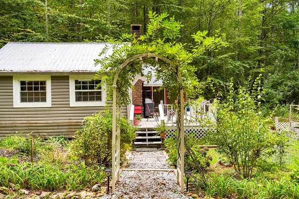 a front view of a house with a small yard