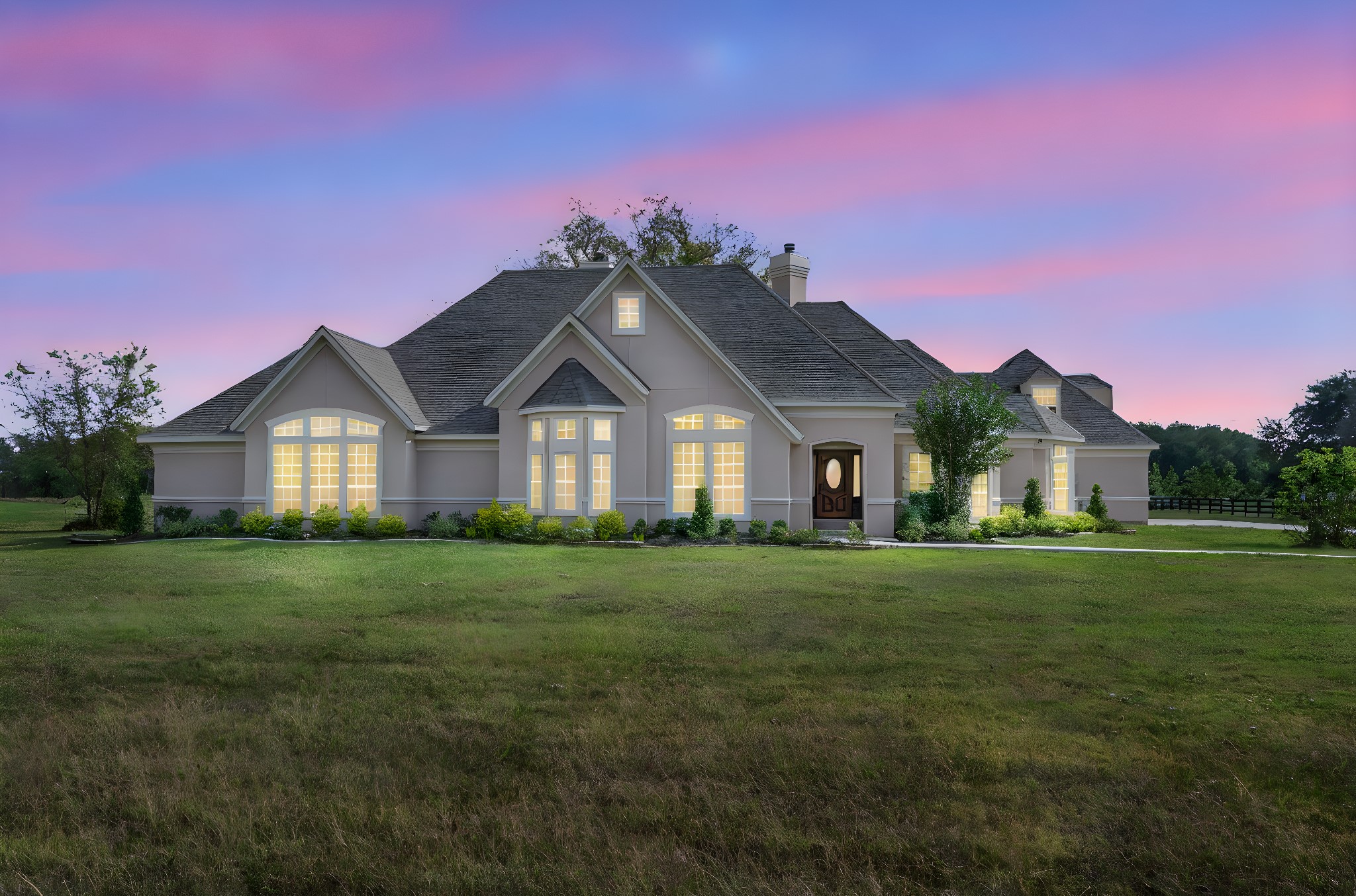 a front view of a house with a yard