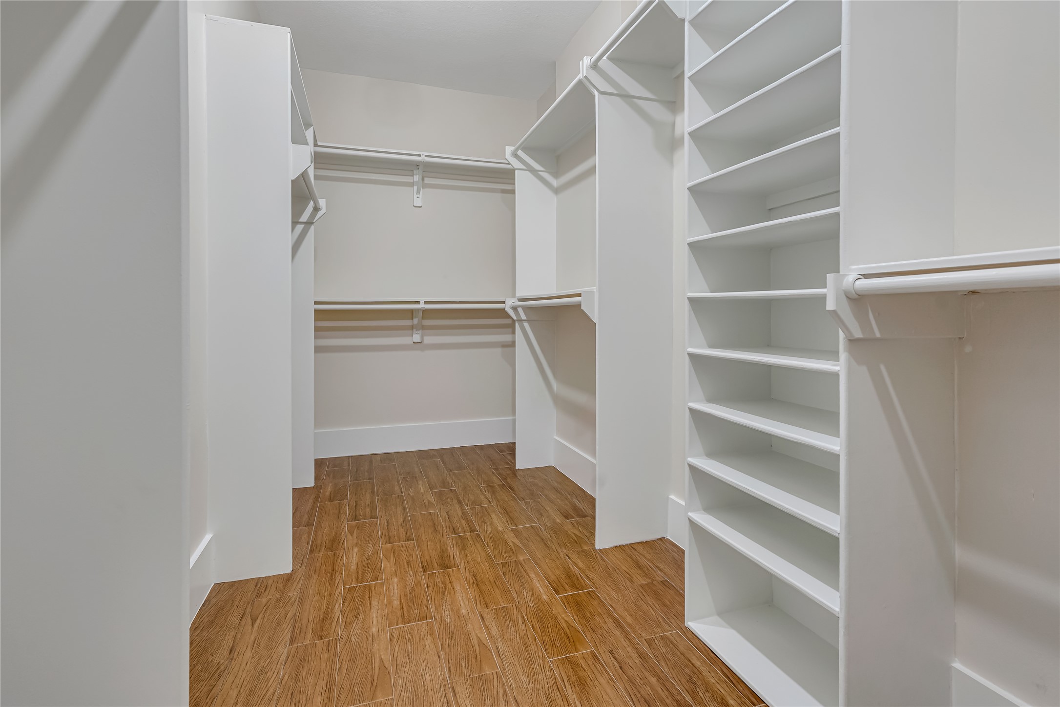 1810 McCrary Road Richmond, TX 77406 - Photo 22 of 25 a view of walk in closet with empty racks