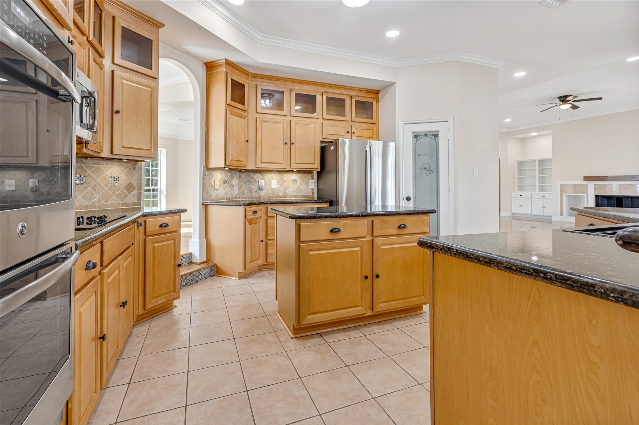 1810 McCrary Road Richmond, TX 77406 - Photo 10 of 25 a kitchen with stainless steel appliances granite countertop a sink and cabinets