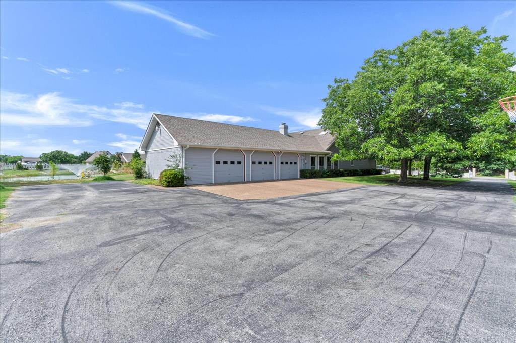 2717 Clear Lake Road Weatherford, TX 76087 - Photo 28 of 40 huge asphalt driveway with expansive room for parking