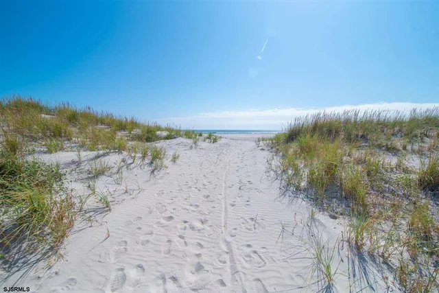 a view of ocean and a yard