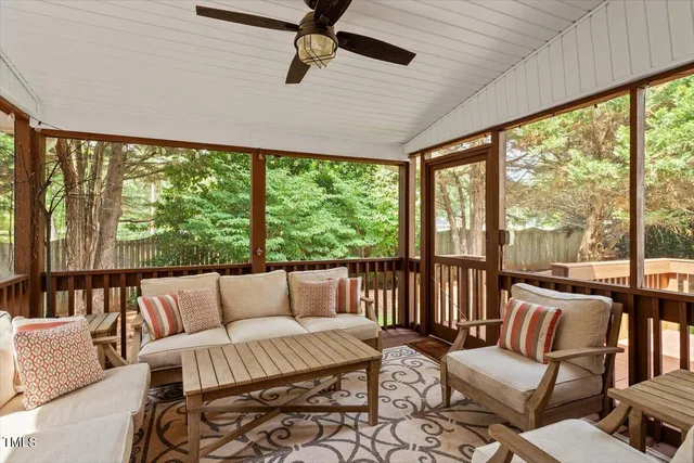 a view of a kitchen with a sink and refrigerator