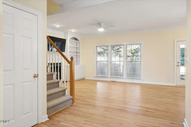 a kitchen with kitchen island granite countertop a sink stainless steel appliances and cabinets
