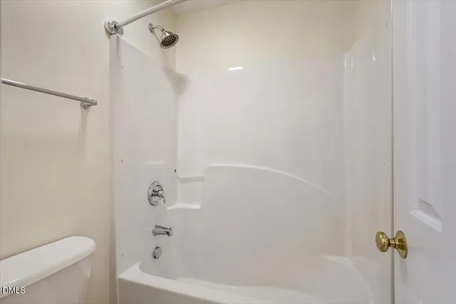 a view of a house with backyard wooden roof and sitting area