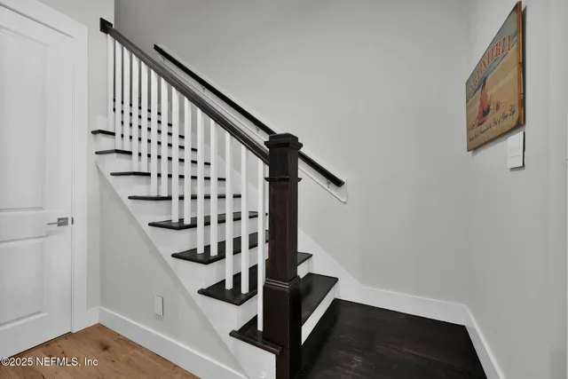 a view of entryway with wooden floor