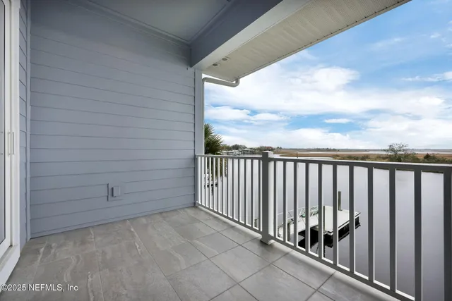 a bedroom with bed and a window