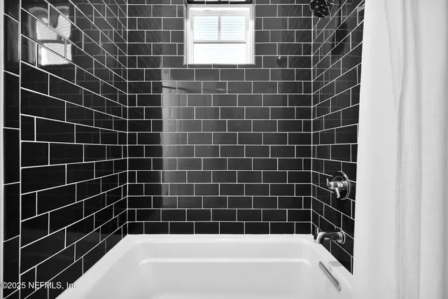 a view of a patio with table and chairs near a yard