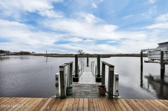 a view of a lake with outdoor seating