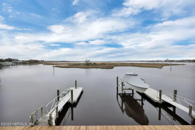 a view of city and ocean with beach