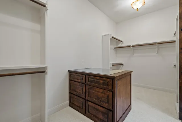 a view of storage and utility room with washer and dryer