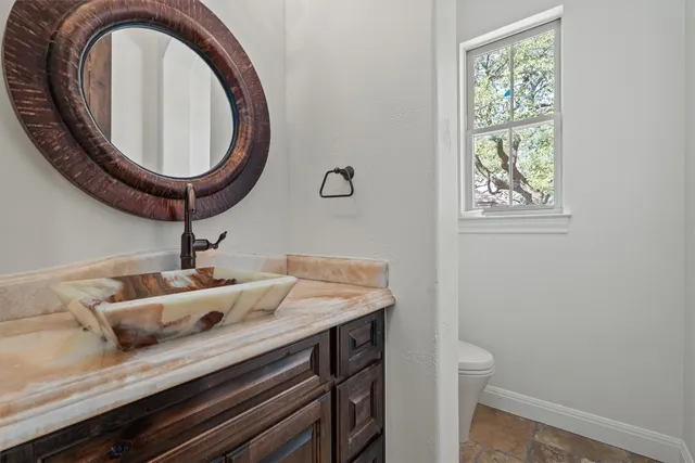 a kitchen with a stove and a refrigerator