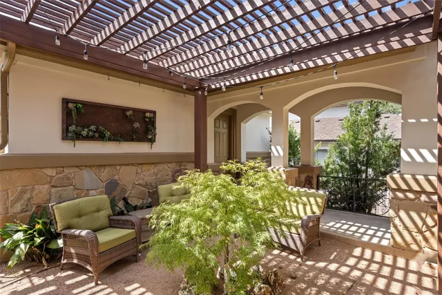 a front view of a house with outdoor seating