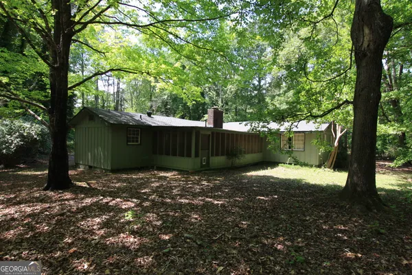 a backyard of a house with lots of green space