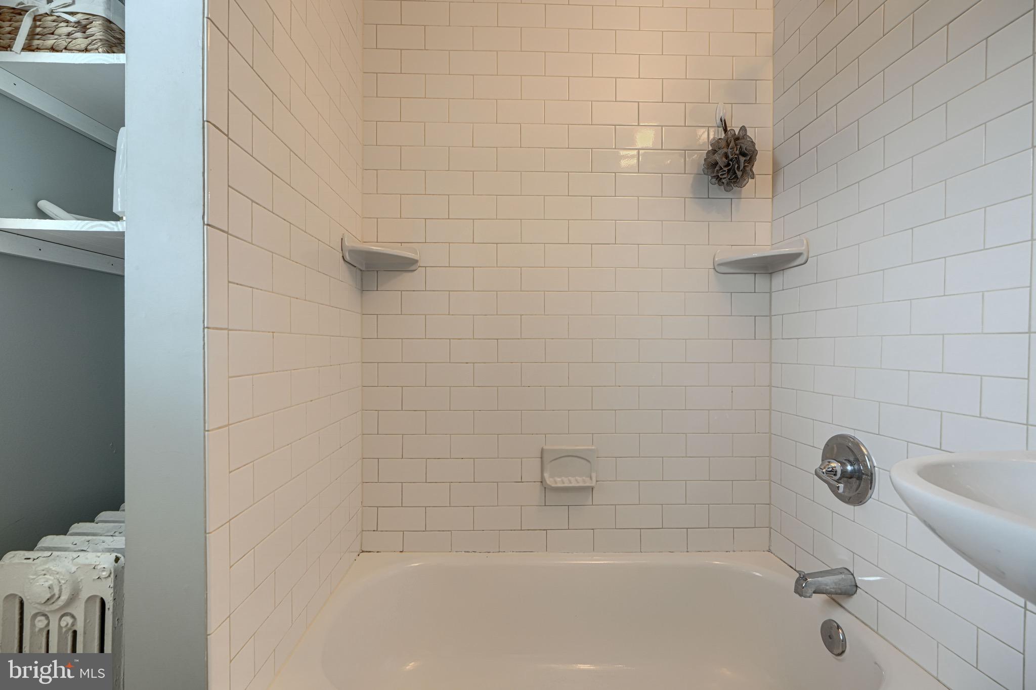 2705 Latona Road Baltimore, MD 21214 - Photo 45 of 53 a bathroom with a bathtub