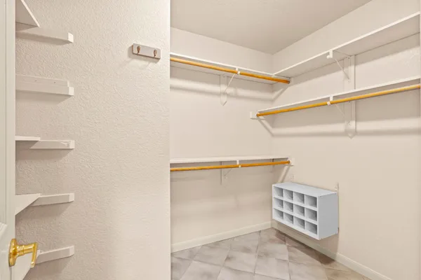 a view of an empty walk in closet