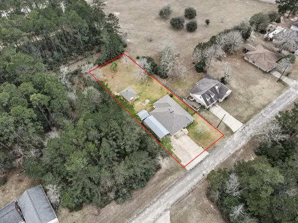 an aerial view of residential houses with outdoor space