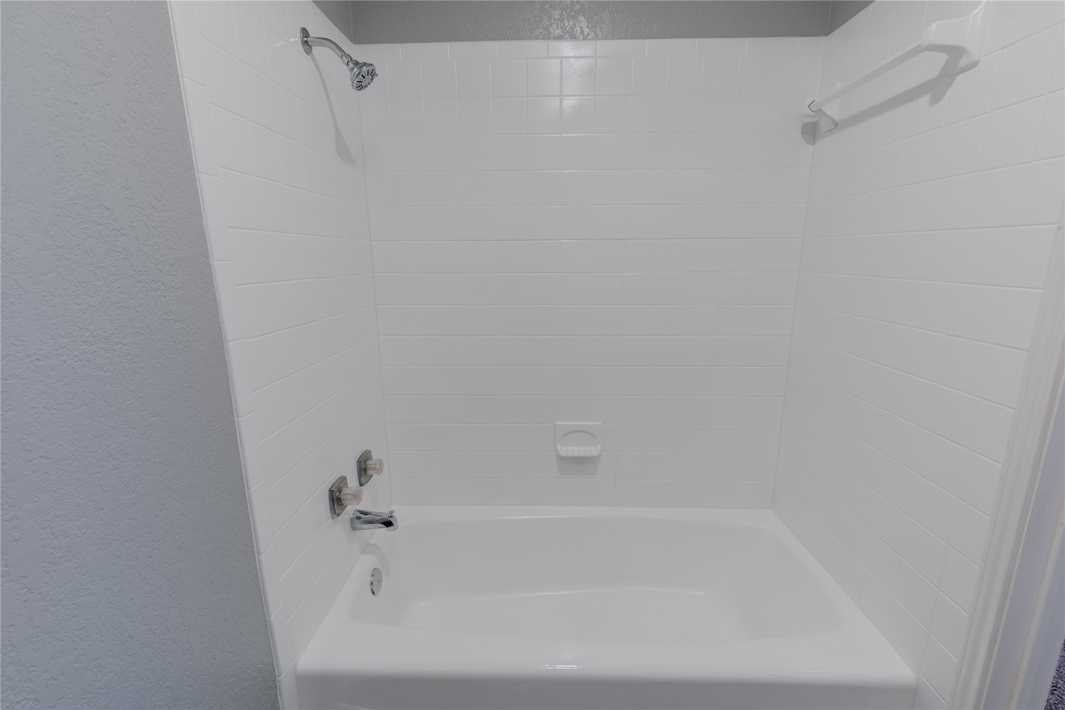 319 Rawhide Loop Round Rock, TX 78681 - Photo 22 of 28 Full bath with a textured wall and shower / tub combination