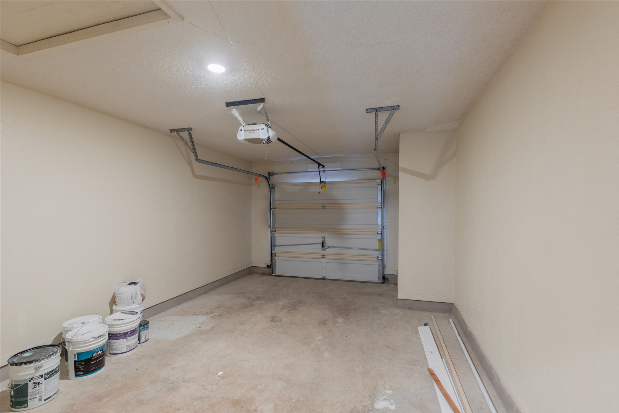 319 Rawhide Loop Round Rock, TX 78681 - Photo 26 of 28 Garage with baseboards and a garage door opener